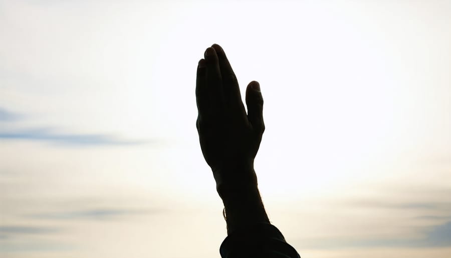 Praying hands silhouette symbolizing prayer and devotion