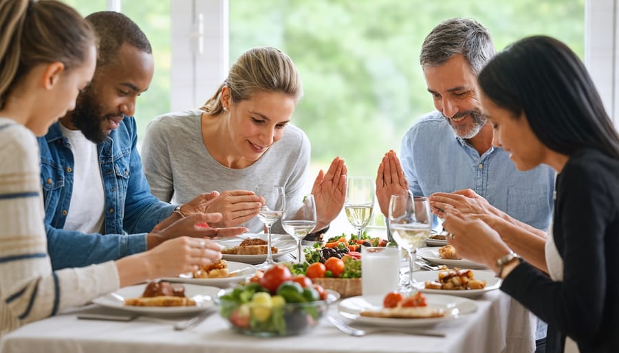 Family of different generations holding hands in prayer before dinner