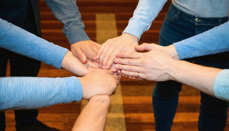 Christian support group members praying together in a circle