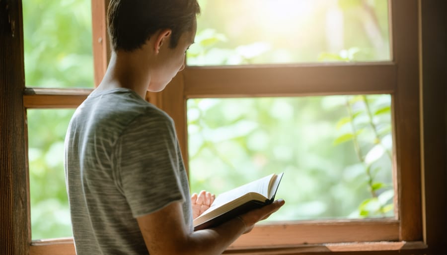 Individual engaged in prayer and Bible study in a serene setting