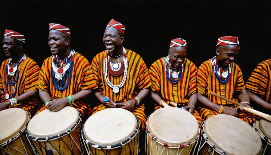 Set of ornately decorated Yoruba talking drums of varying sizes used in sacred worship